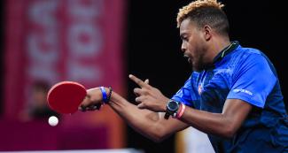 Cuban Jorge Campos focuses on the ball in the Lima 2019 table tennis mixed doubles competition against Argentina at the National Sports Village – VIDENA.
