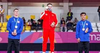 Jeffrey Gluckstein (USA), Jeremy Chartier (Canada) and Ruben Padilla (USA) with their medals in ceremony for men’s trampoline gymnastics at Lima 2019 held at the Villa El Salvador Sports Center