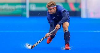 USA’s hockey player Michael Barminski focusing on the ball during the Lima 2019 hockey game held at the Villa María del Triunfo Sports Center