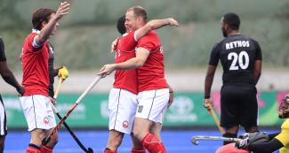 Chilean team players celebrate after scoring a goal in the Lima 2019 hockey game against Trinidad and Tobago, at the Villa María del Triunfo Sports Center