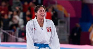 Peruvian Alexandra Grande achieves victory for Peru in women’s karate at the Lima 2019 Villa El Salvador Sports Center.