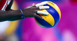 Brazilian volleyball player gets ready to serve to Cuban team in the Lima 2019 match at the Callao Regional Sports Village