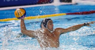 American Water Polo player Obert Alexander with the ball at the Lima 2019 Games in Villa María del Triunfo