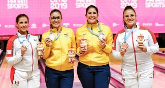 Aseret Zetter from Mexico (silver), Clara Guerrero from Colombia (gold), Maria Rodriguez from Colombia and Iliana Lomeli from Mexico (bronze) show their Lima 2019 bowling medals at the National Sports Village – VIDENA.