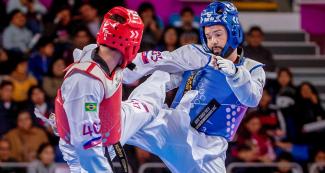Costa Rica’s Andres Molina faces off against Brazil’s Bruno da Mota in Lima 2019 men’s Para taekwondo K44 -75 kg at the Callao Regional Sports Village.