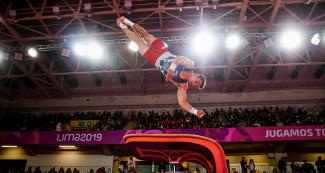 Grant Breckenridge from the US competes in the men’s artistic gymnastics event at Lima 2019, in the Villa El Salvador Sports Center