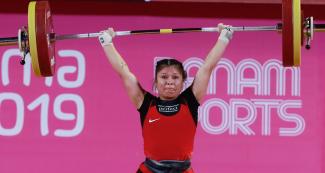 Shoely Mego from Peru competes in the women’s 55 kg weightlifting event at Lima 2019 held at the Chorrillos Military School	