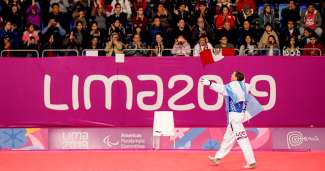 Juan Samorano celebrates his bronze medal in Para taekwondo in the Parapan American Games Lima 2019
