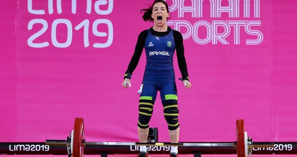 Natasha Figueiredo drops the weights after finishing her performance