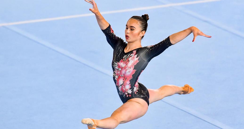 Victoria Woo jumps during her artistic gymnastics routine at Lima 2019 in Villa El Salvador Sports Center 