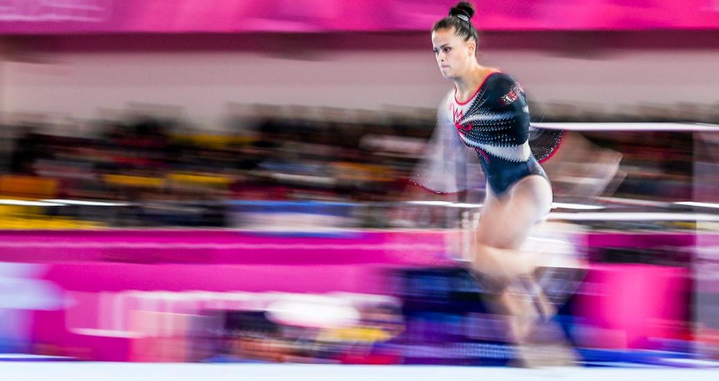 Ariana Orrego runs at top speed to perform a flip during the artistic gymnastics competition at Lima 2019 