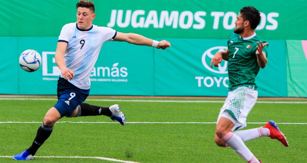 Julian Gaich (Argentina) and Paolo Martin (Mexico) face off in the Lima 2019 Pan American Games football competition at the stadium of the National University of San Marcos.