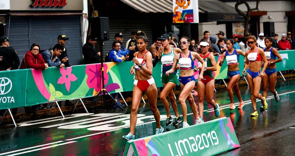 Peruvian athlete leading the Lima 2019 race walking competition at Parque Kennedy in Miraflores. 