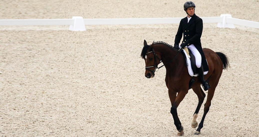 Argentinian Marcelo Rawson shows confidence in riding his horse during the Lima 2019 dressage event at the Army Equestrian School