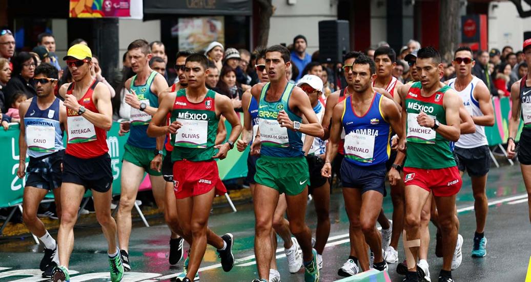 Lima 2019 race walk athletes from different countries push themselves step by step at Parque Kennedy in Miraflores.