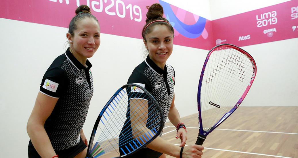 Samantha Salas and Paola Longoria from Mexico smile after beating the USA in Lima 2019 racquetball semifinals at the Callao Regional Sports Village
