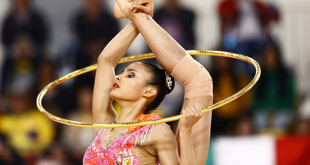 Oriana Viñas showcasing her talent and flexibility in individual rhythmic gymnastics at Villa El Salvador Sports Center at the Lima 2019 Games