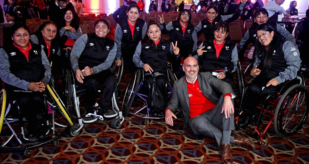 Para athletes in wheelchairs pose for a photo with the president of the Peruvian Institute of Sports, Sebastian Suito, at the presentation ceremony of the Peruvian delegation for the Lima 2019 Parapan American Games