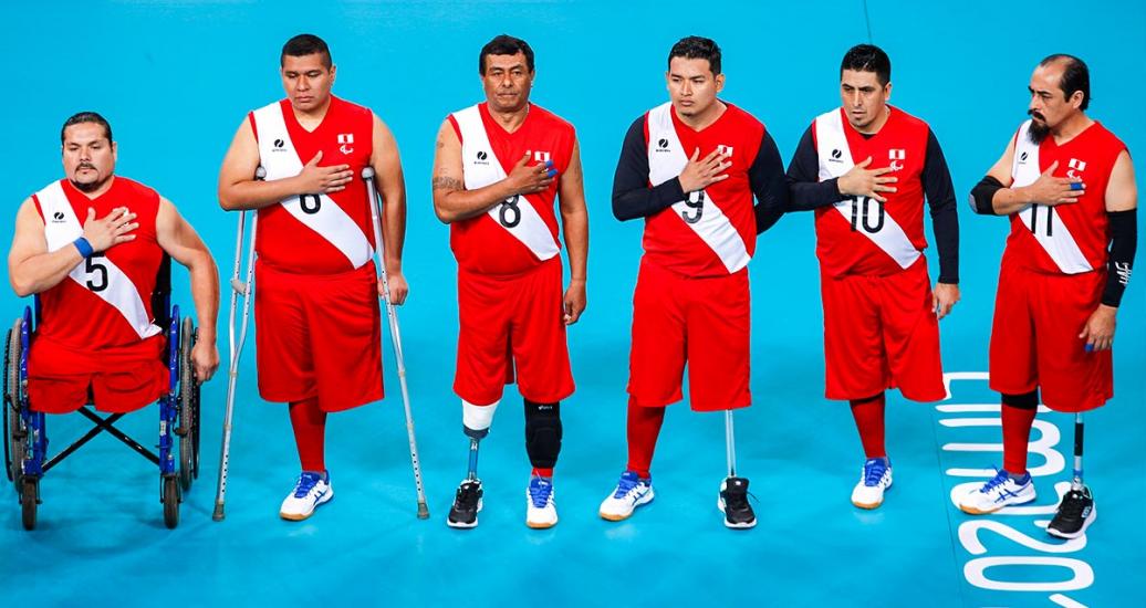 The Peruvian sitting volleyball team listens to the national anthem before facing off the USA at the Lima 2019 Parapan American Games, at Callao Regional Sports Village