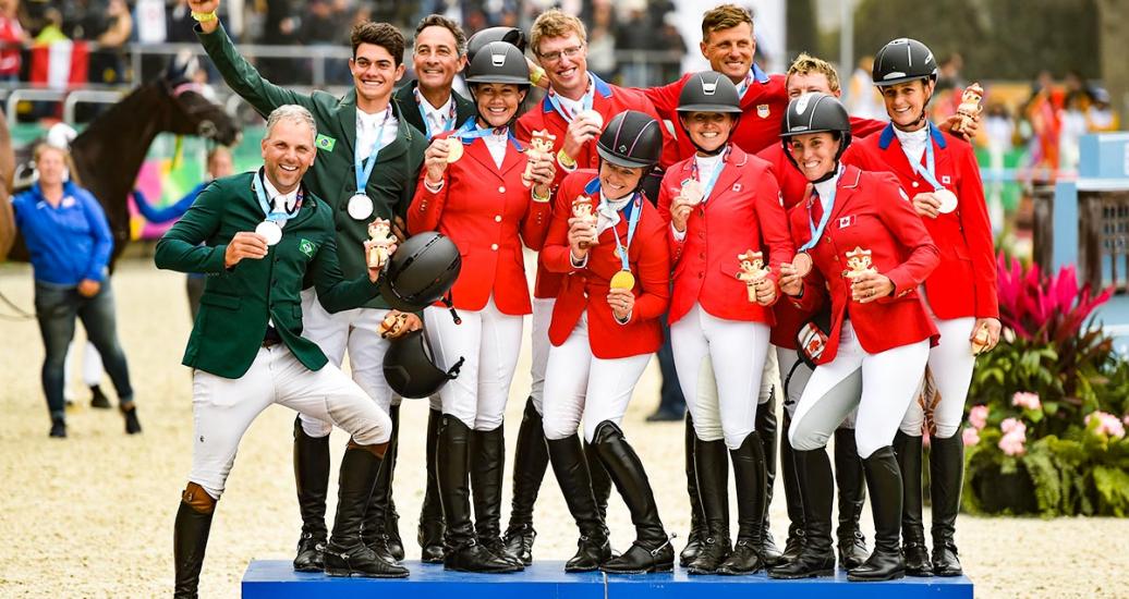 Canada (bronze), Brazil (silver), and USA (gold) showing off their medals after Lima 2019 equestrian jumping team event at the Army Equestrian School
