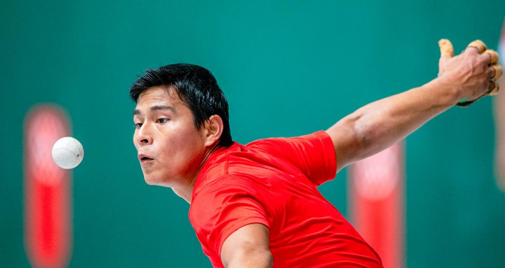 Bolivian player Josias Bazo about to strike the ball during Basque pelota qualification at the Villa María del Triunfo Sports Center, at the Lima 2019 Pan American Games