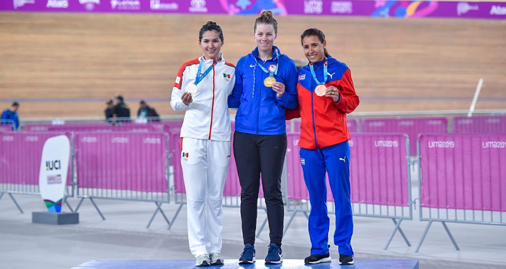 Cuban Arlenis Sierra (bronze), Mexican Lizbeth Salazar (silver), and American Jennifer Valente (gold) proudly pose with their medals in Lima 2019 women’s omnium competition at the National Sports Village (VIDENA)