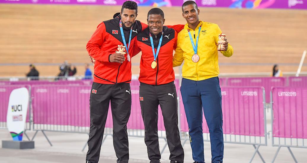Njisane Phillip and Nicholas Paul of Trinidad and Tobago, and Kevin Quintero of Colombia show their silver, gold and bronze medals, respectively, in track cycling at the Callao Regional Sports Village. 