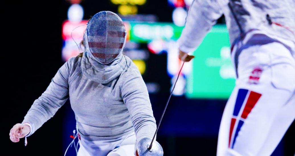 Chloe Fox-Gitomer from the United States against Rossy Feliz from the Dominican Republic in women’s fencing competition held at the Lima Convention Center