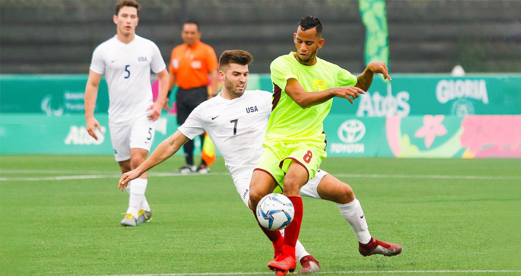 Adam Ballou, from the US, fights for the ball with Richard Mogollon, from Venezuela, in football 7-a-side at the Villa María del Triunfo Sports Center, at Lima 2019
