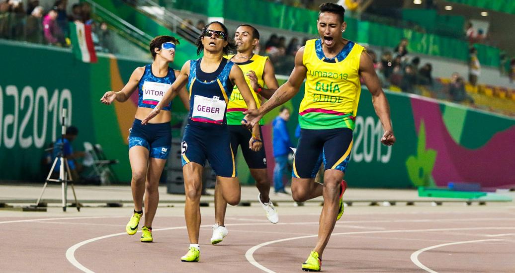Jerusa Geber Dos Santos with her guide, Gabriel Dos Santos, and Vitoria Simplicio with her guide, Felipe Veloso, competing in women’s 200 m T11 at the National Sports Village - VIDENA