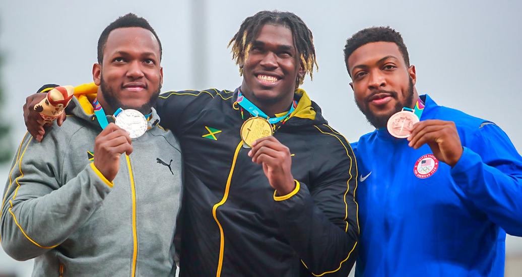 Jamaicans Jamie Smikle, Andray Dacres and the American Reginald Jagers show their medals in the medal ceremony