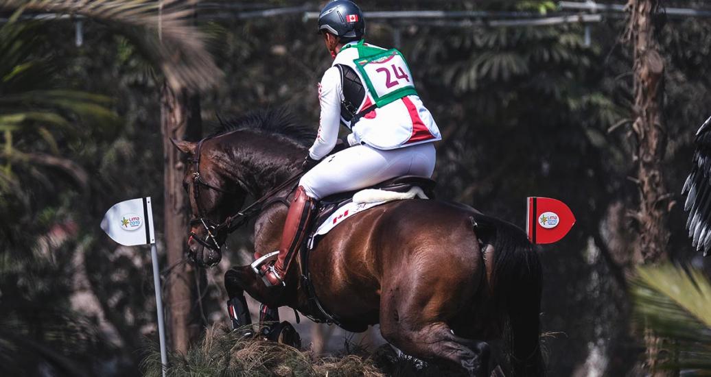 Erin Loach riding her horse Golden Eye during the Lima 2019 eventing competition held at the Army Equestrian School