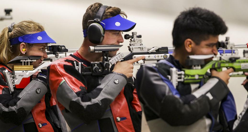 Minden Miles from the US and Luis Mendoza and Lucas Kzeniesky from Puerto Rico, getting ready to shoot in the 10m mixed air rifle Lima 2019 Games competition at Las Palmas Air Base